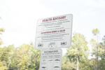 Health Advisory Sign on the Waccamaw River by The Athenaeum Press
