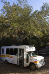 Sandy Island Church Bus Parked Under a Tree by The Athenaeum Press