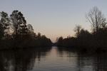 Sunset Through Trees on the River 5 by The Athenaeum Press