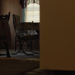 Inside Wilma's Cottage, Empty Chair and Table by The Athenaeum Press