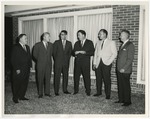 A group of men in suits by Lonnie W. Fleming Sr.