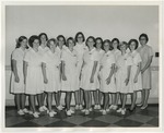 Thirteen female nurses and instructor by Lonnie W. Fleming Sr.