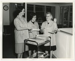 Three female workers sorting through the mail by Lonnie W. Fleming Sr.