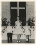 Three young children standing in the front of a church by Lonnie W. Fleming Sr.