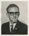 A male with a dark plaid suit on by Lonnie W. Fleming Sr.