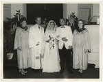 Bride and groom standing in the front of the church by Lonnie W. Fleming Sr.