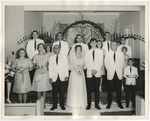 Bride and groom at the front of the church with their wedding party by Lonnie W. Fleming Sr.