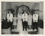 Bride and groom with people standing at their sides by Lonnie W. Fleming Sr.