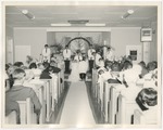 Bride and groom kneeling at church altar by Lonnie W. Fleming Sr.