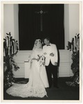 Bride and groom at the front of the church alone by Lonnie W. Fleming Sr.