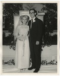 Photo of a bride and groom at the front of the church standing on a white sheet by Lonnie W. Fleming Sr.