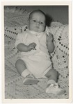 Photo of a baby on a white blanket by Lonnie W. Fleming Sr.