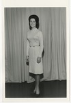 Photo of a woman wearing a white dress and dark colored high heels by Lonnie W. Fleming Sr.