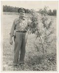 Photo of a man standing in a field beside of a tree/plant of some kind by Lonnie W. Fleming Sr.