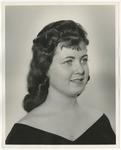 Photo of a young lady with long curly hair that ends at her shoulder blades by Lonnie W. Fleming Sr.