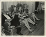 Photo of bridesmaids sitting on a sofa by Lonnie W. Fleming Sr.