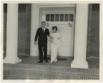 Photo of a bride and groom exiting a church between two columns by Lonnie W. Fleming Sr.