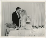 Photo of a bride feeding the groom cake by Lonnie W. Fleming Sr.