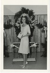 Photo of a female in a light colored dress that ends at her knees by Lonnie W. Fleming Sr.