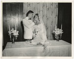 A Photo of a groom feeding the bride by Lonnie W. Fleming Sr.