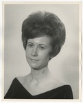 Photo of a woman wearing a black v necked shirt by Lonnie W. Fleming Sr.