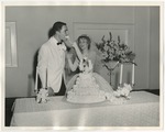 Photo of a bride feeding the groom a piece of cake by Lonnie W. Fleming Sr.