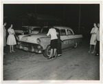 Photo of a lady and a child writing on the groom's car by Lonnie W. Fleming Sr.