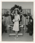 Photo of a woman in a white dress that ends at her knees by Lonnie W. Fleming Sr.