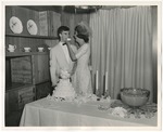 Photo of the bride feeding the groom cake by Lonnie W. Fleming Sr.