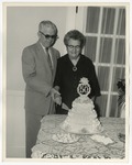 Photo of an elderly couple cutting their 50th wedding anniversary cake by Lonnie W. Fleming Sr.