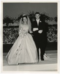 Photo of a bride and groom standing on a white sheet by Lonnie W. Fleming Sr.