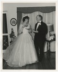 Photo of a bride and groom enjoying light refreshments in a home by Lonnie W. Fleming Sr.