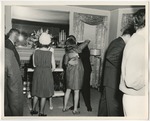 Photo of a woman and man hugging near the fireplace at a wedding by Lonnie W. Fleming Sr.