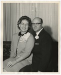 Photo of a middle-aged couple sitting on the sofa by Lonnie W. Fleming Sr.