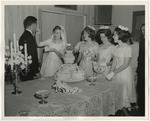 Photo of a bride feeding a groom a piece of cake by Lonnie W. Fleming Sr.