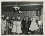 Photo of a bride throwing her bouquet in the air for a bridesmaid to catch by Lonnie W. Fleming Sr.