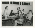 Photo of the yearbook committee working at a table at Conway High School by Lonnie W. Fleming Sr.