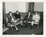 Photo of four Conway High School males sitting with their legs crossed by Lonnie W. Fleming Sr.