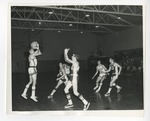 A picture of six males playing basketball in the Conway High School gymnasium by Lonnie W. Fleming Sr.