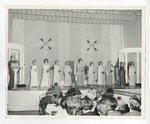 A photo of ten girls on stage in what looks like a beauty pageant by Lonnie W. Fleming Sr.