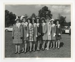 A photo of nine girls posing in a row for a picture by Lonnie W. Fleming Sr.