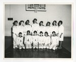 A photo of thirteen African American girls on some sort of sports team posing for a picture by Lonnie W. Fleming Sr.