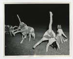 A photo of cheerleaders doing cartwheels by Lonnie W. Fleming Sr.