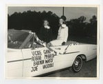 A photo of two girls in a white car by Lonnie W. Fleming Sr.