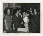 A photo of a group of people in a cramped room after the National Honor Society induction ceremony by Lonnie W. Fleming Sr.