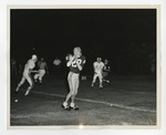 A photo of a Conway High School football player holding a football during a game by Lonnie W. Fleming Sr.