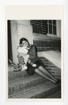 A photo of a young lady hugging a plush tiger on the steps of Conway High School (Becky Ricks Floyd) by Lonnie W. Fleming Sr.