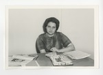 A photo of a lady with newspapers around her by Lonnie W. Fleming Sr.