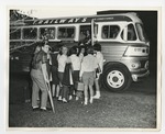 A photo of a group of students getting on an air-conditioned bus by Lonnie W. Fleming Sr.