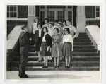A photo of a group of eleven boys and girls gathered on the steps of Conway High School by Lonnie W. Fleming Sr.